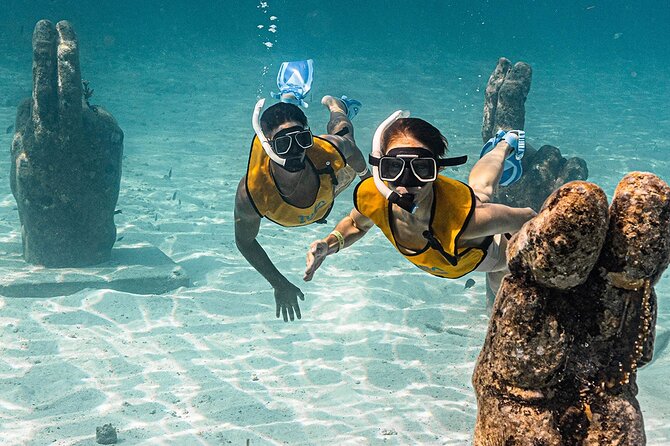 All-Inclusive Isla Mujeres Catamaran with Free Transportation - El Meco Reef snorkeling: guided, gear included, time-boxed