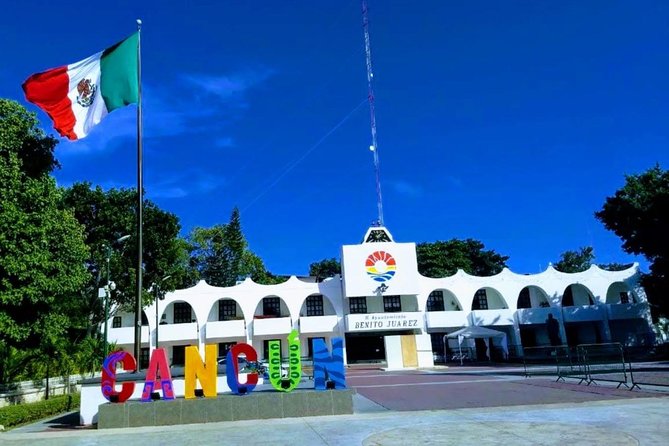Cancun City Sightseeing and Shopping Tour on a Double Decker bus - Playa Delfines and El Mirador: The Cancun Sign Photo Moment