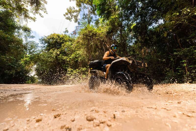 Cancun: Jungle ATV Tour, Ziplining, and Cenote Swim - Ziplining Over the Canopy: Three Runs, Tight Fit Limits