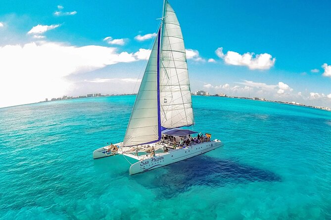 Catamaran Tour to Isla Mujeres from Cancún with Bar and Lunch - Beach club access and Mexican buffet lunch: where the day slows down