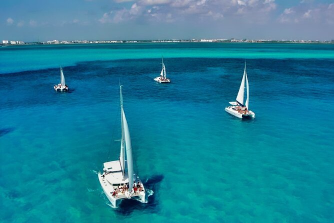 Isla Mujeres Catamaran Sailing Experience with Lunch & Open Bar - Isla Mujeres downtown time: shopping, sightseeing, and Playa Norte options