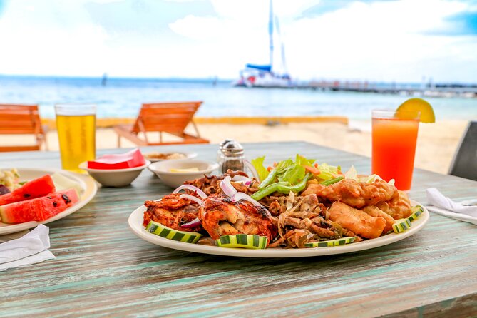 Isla Mujeres Catamaran Tour with Open Bar, Lunch and Snorkeling - Beach club + buffet lunch: good for recovery, mixed for expectations