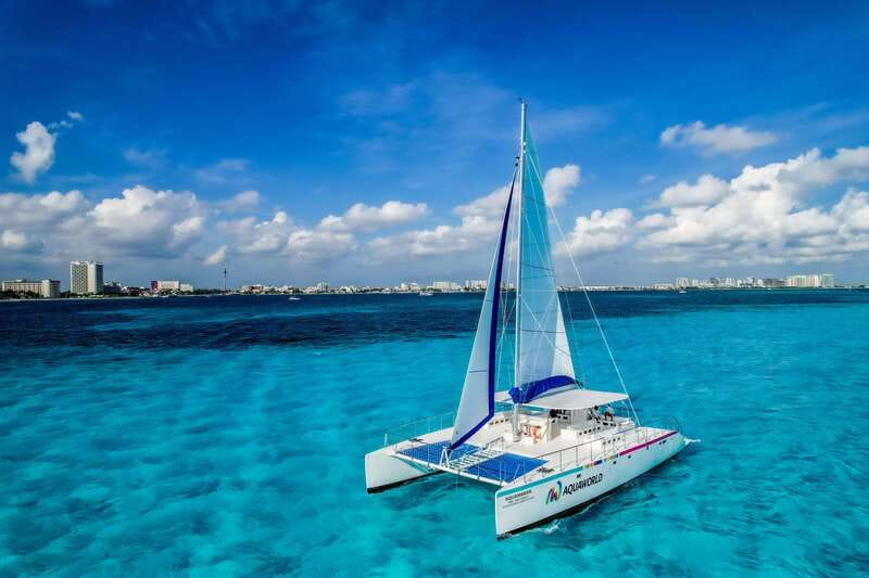 Isla Mujeres: Catamaran with Open Bar, Snorkeling and Lunch - Onboard atmosphere: open bar, music, and how the crew keeps things moving