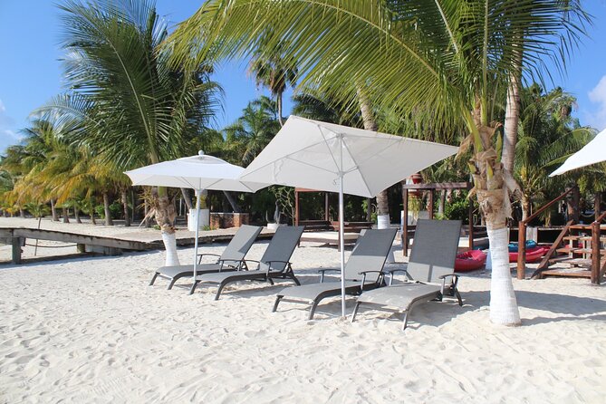 Isla Mujeres Day Tour with Catamaran, Snorkeling & Beach Club - Isla Mujeres free time: Playa Norte, self-exploring, and vendor pressure