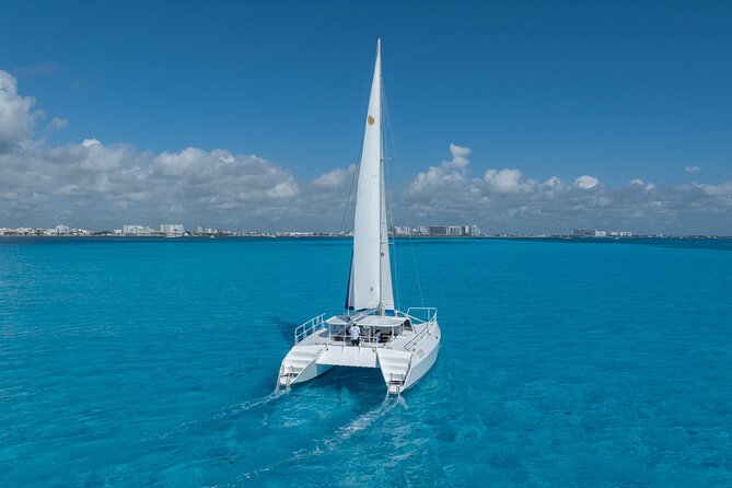 Isla Mujeres Day Tour with Catamaran, Snorkeling & Beach Club - What’s not included: photos, souvenirs, and the extra costs you’ll actually feel