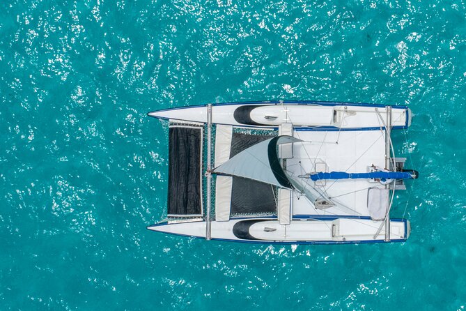 Isla Mujeres Premium Tour in Private Catamaran with Lunch - Stop 5: Isla Mujeres on board—sunset sail and possible spinnaker flight