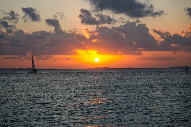Isla Mujeres Sunset Cruise and Tour from Cancun - Onboard catamaran vibe: drinks, music, and that safety-first feeling