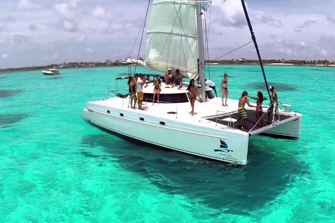 Isla Mujeres tour in a Catamaran with snorkel, open bar, lunch - Snorkeling reality check: conditions, language, and comfort level