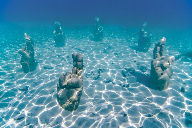 Top Isla Mujeres Catamaran Tour with Snorkel Open Bar and Buffet lunch - El Meco Reef snorkeling: short, guided, and safety-first